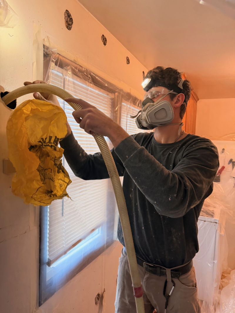 Insulation being added to a client’s walls by Franek Construction Inc.