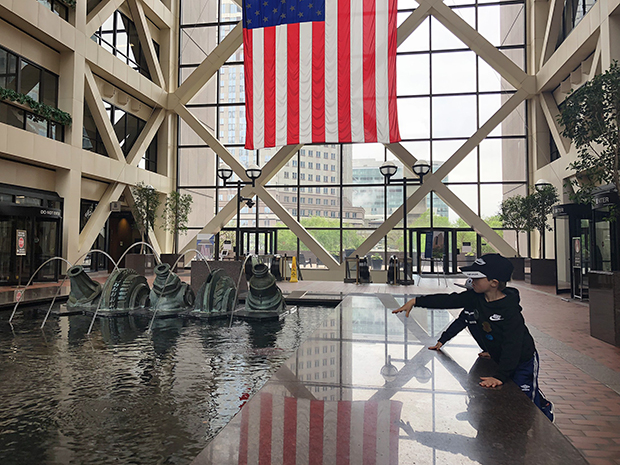 Youth spend time near the Government Center water fountain.