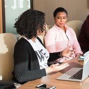 Two people at a cohort learning class. 