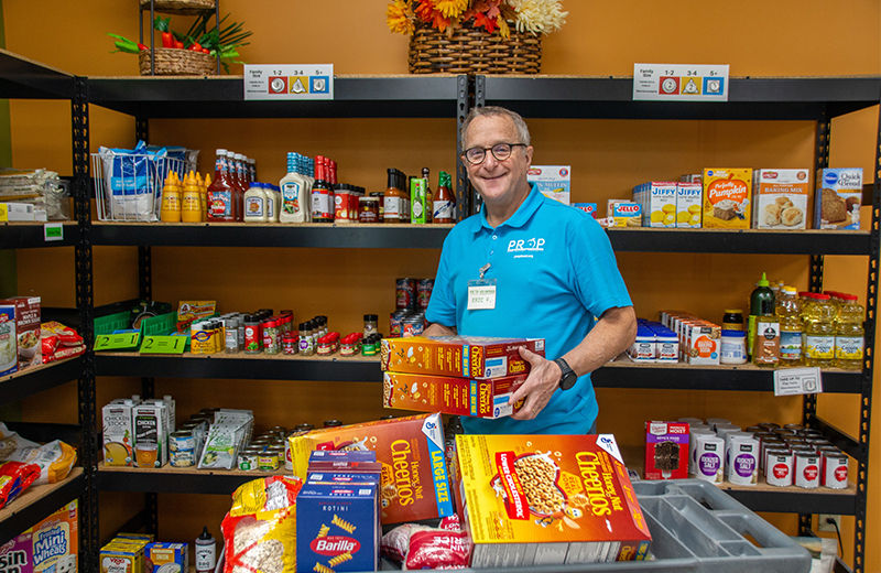 man standing in the food shelf