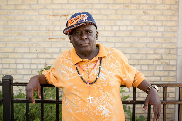 man in front of his apartment