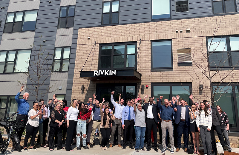 people standing in front of a building