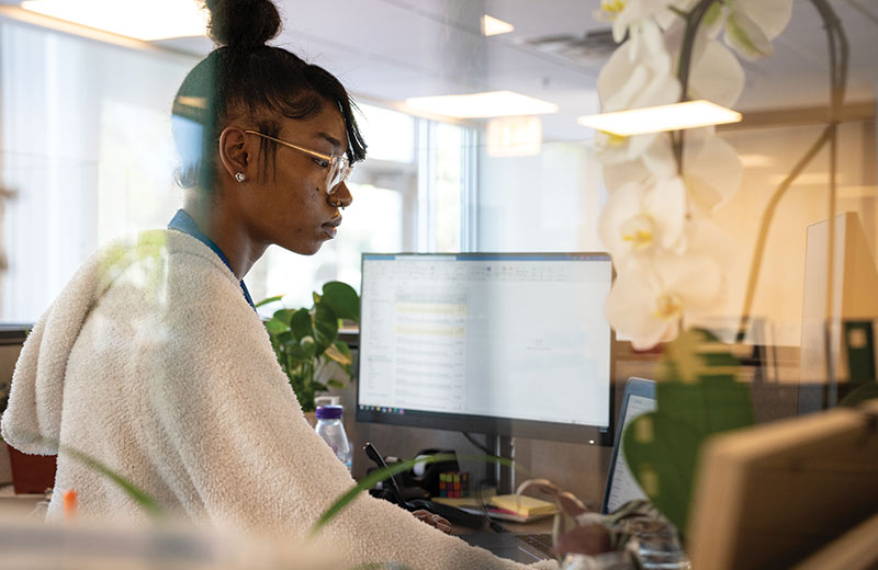women working at her desk